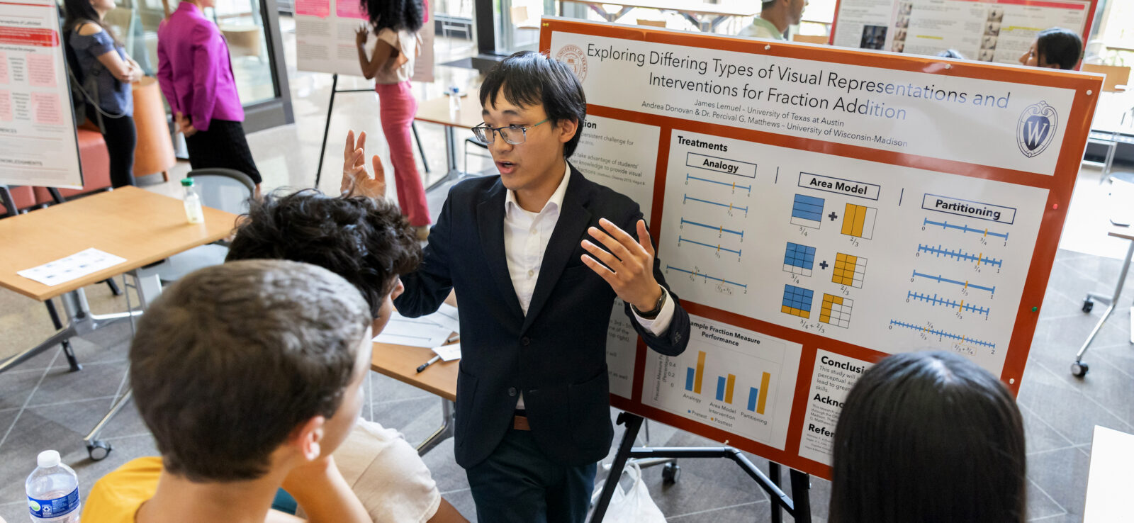 student presenting research to a group at a poster fair