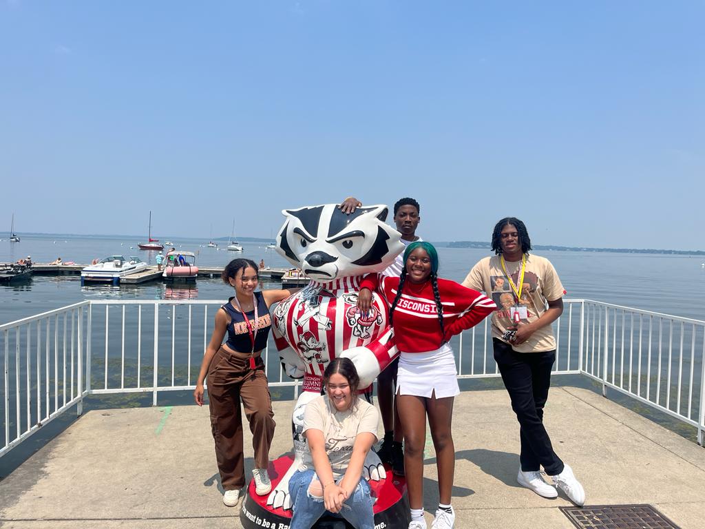 CAPE students posing with Bucky statue