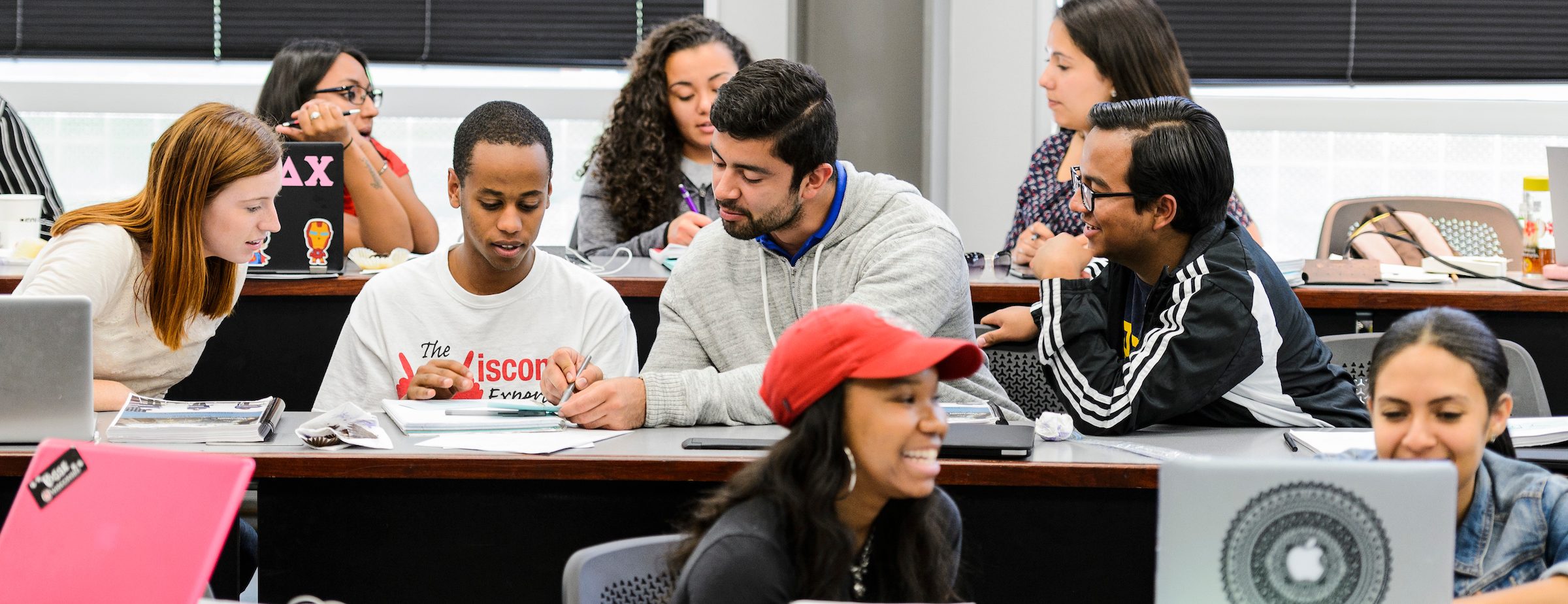 Teaching Assistant helping student with assignment.