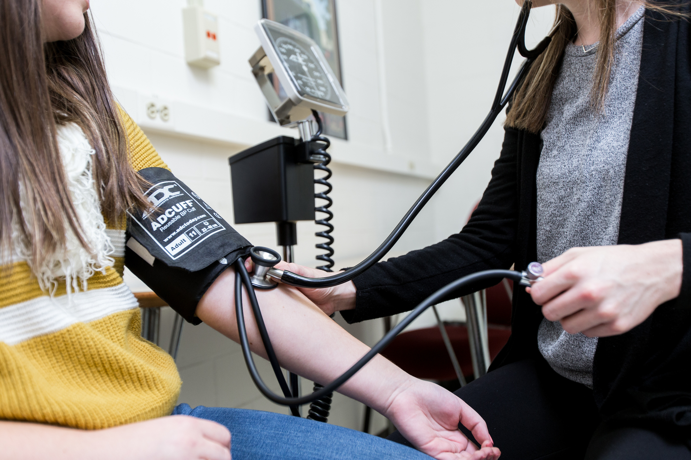 a patient getting their blood pressure checked