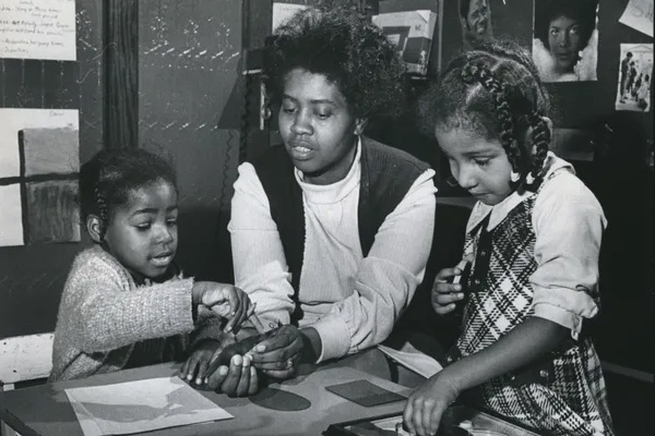 Dean Haddix's grandmother teaching 4 year old students prereading skills