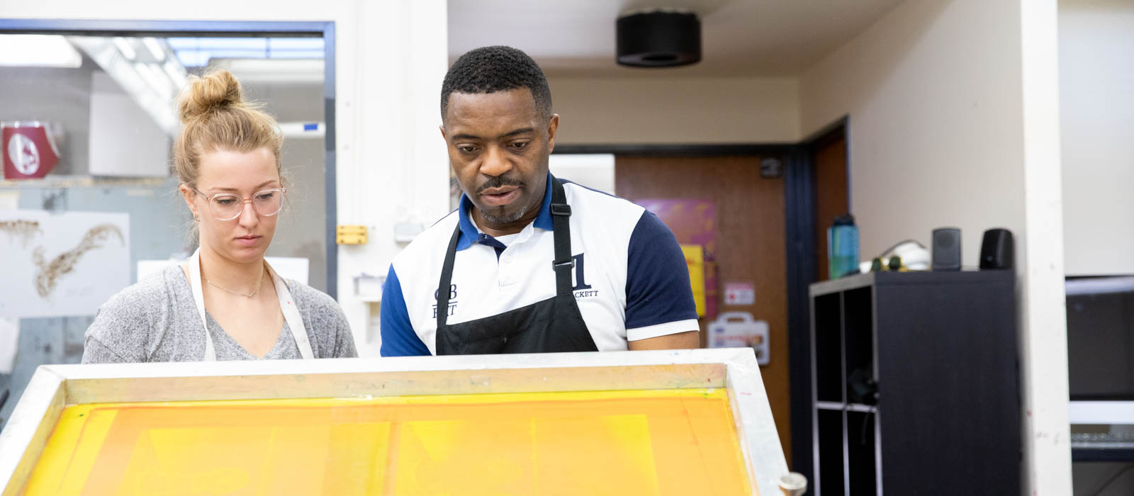 Faisal working with a student