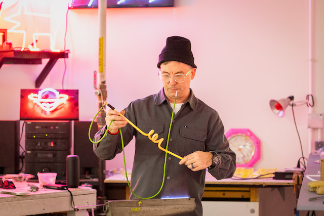 Tom Zickuhr of the Art Department does neon work