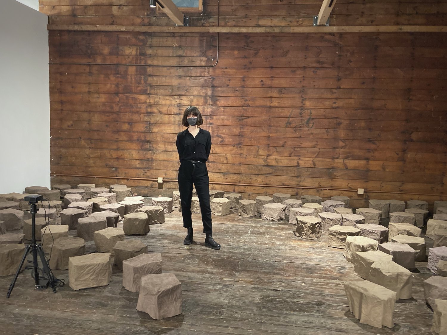 Helen Hawley stands within her installation representing lake sediment