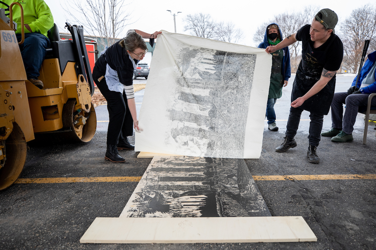 Fresh Hot Press student organization making a steamrolled print at Tandem Press