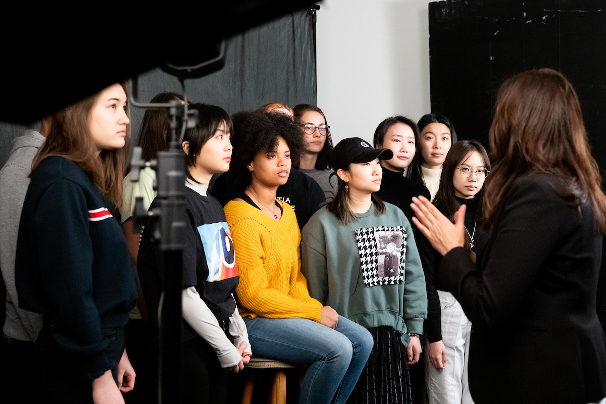  Darcy Padilla, assistant professor in the School of Education’s Art Department, demonstrates to her intermediate photography class how to move and adjust studio lights.