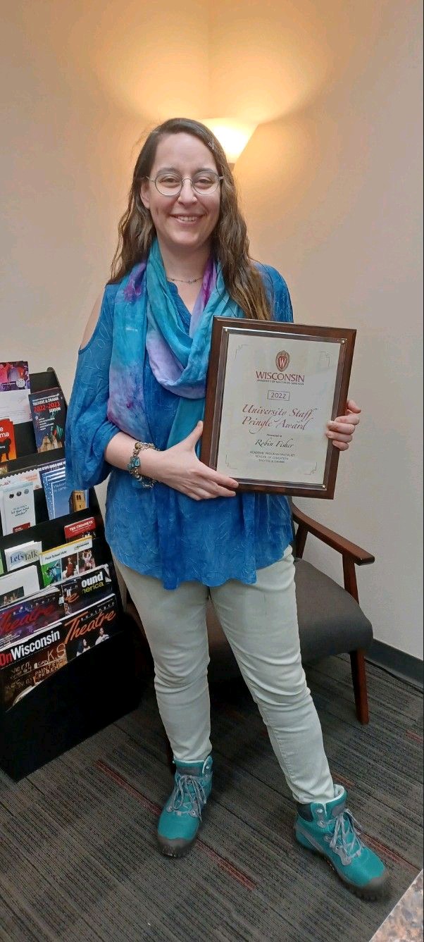 Robin Fisher holds Pringle Award