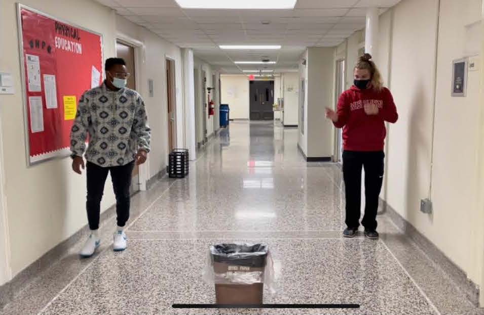 Two PE students play Reverse Pig Trash Ball
