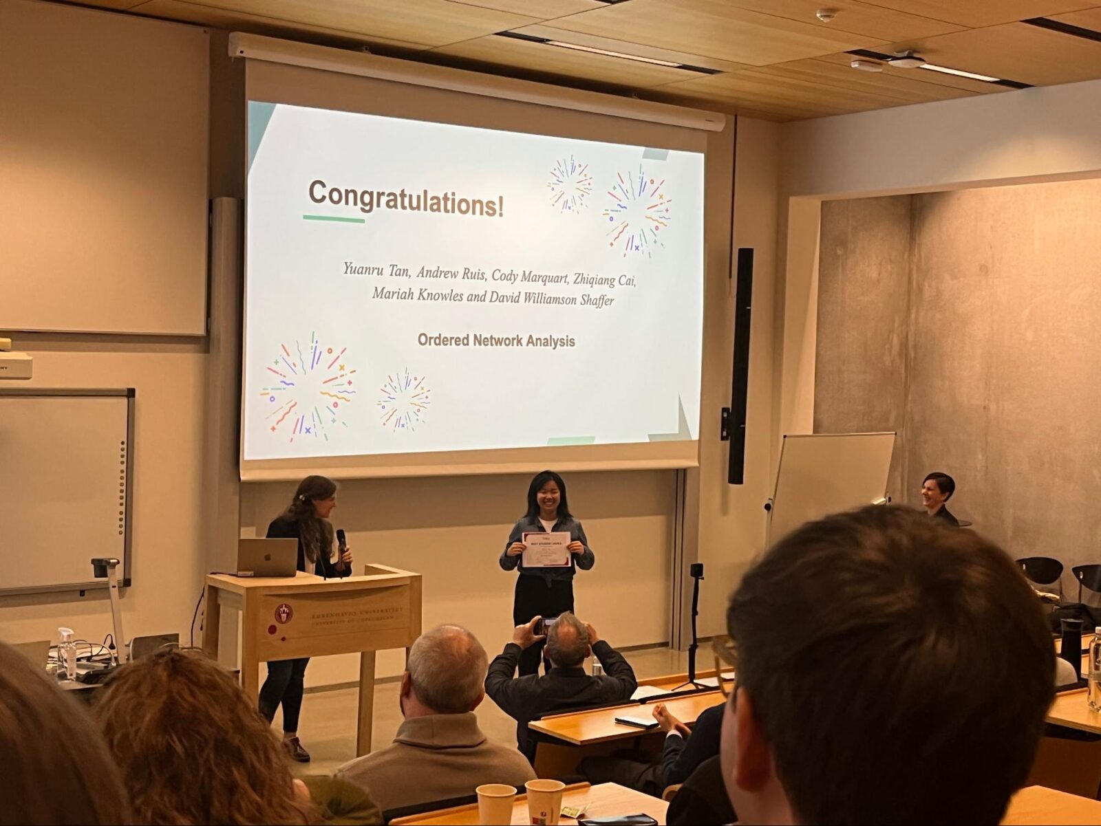 Yuanru Tan accepts the Best Student Paper Award at the International Conference on Quantitative Ethnography