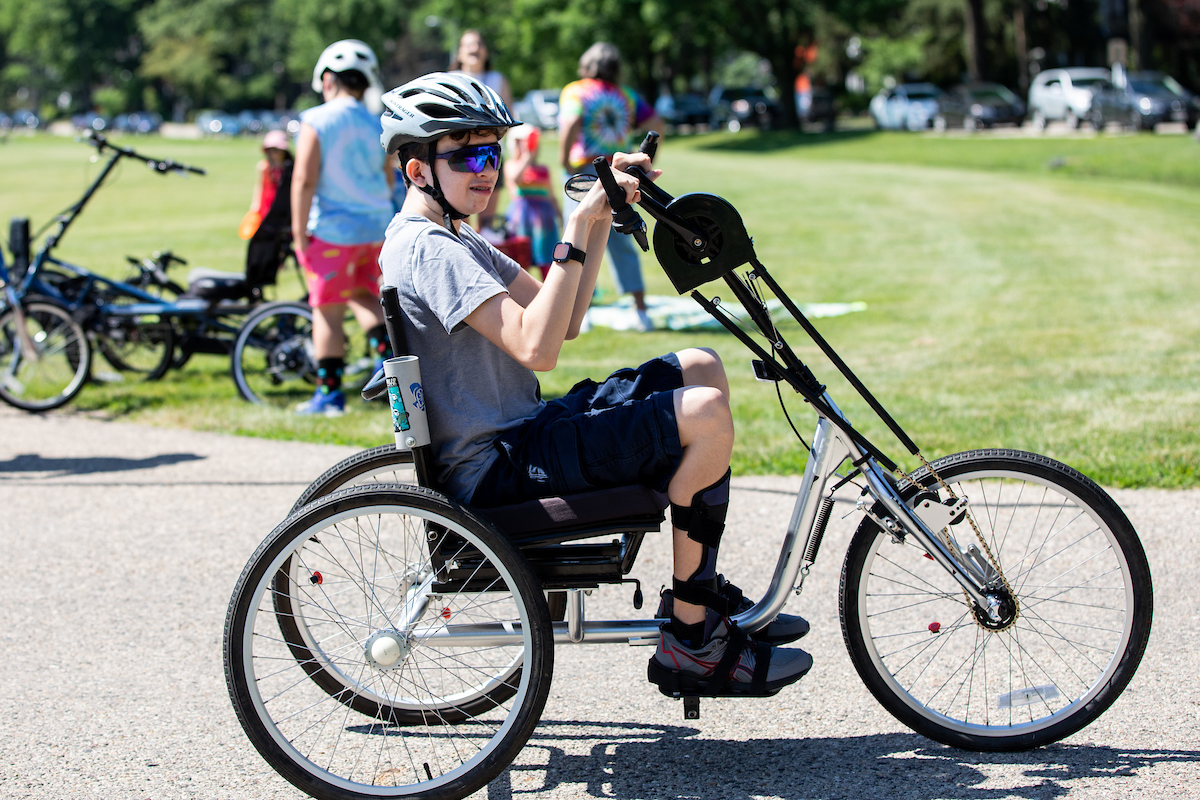 Participant alone riding three-wheel