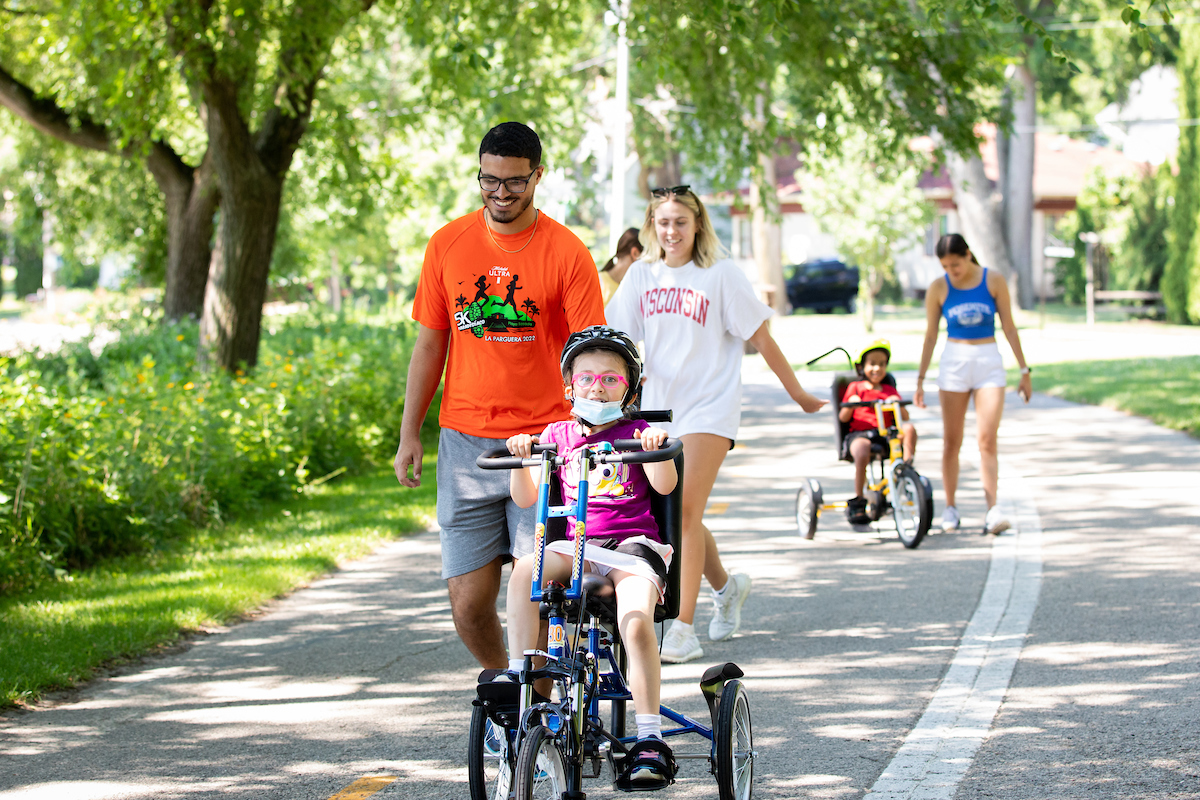 Helping participant on bike