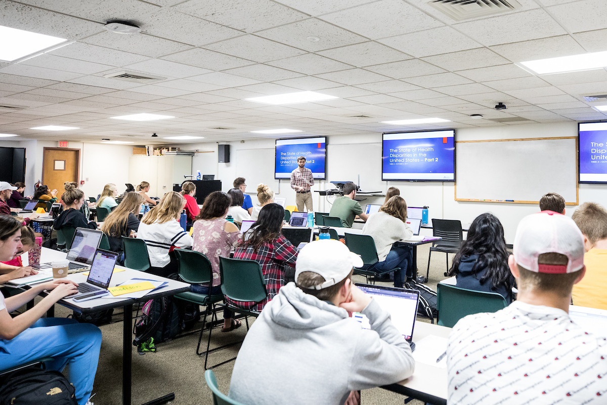 Students sitting in a classroom learning about Health Promotion and Health Equity
