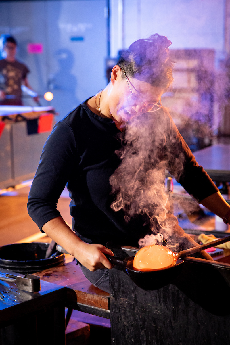 Helen Lee works with steaming glass