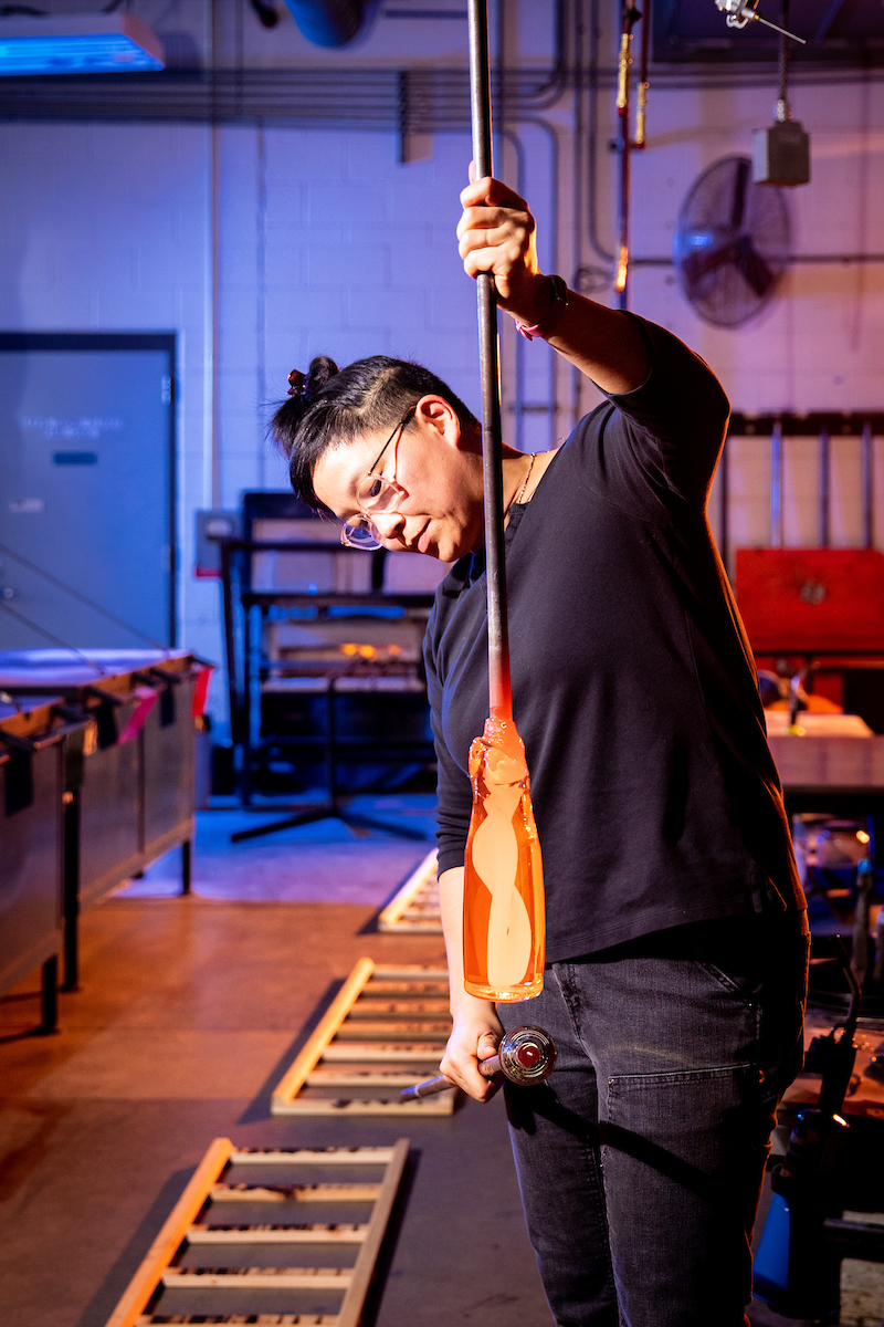 Helen Lee working with glass