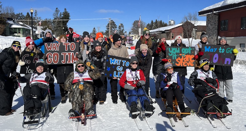 Clients of UW–Madison’s Adapted Fitness program, along with caregivers and student volunteers, pose for a group photo