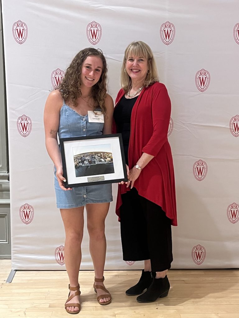 Schneider (left) receives her award