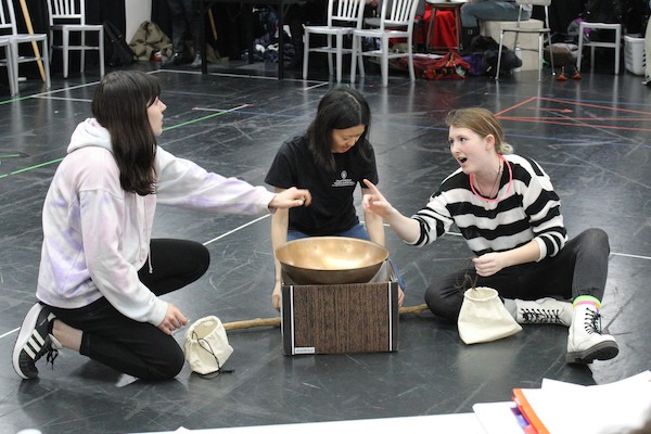 Sophia Scmidt, Grace Ruelle, and Claire Foote as the witches in rehearsal