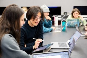 Lee (right) working with a UW–Madison student