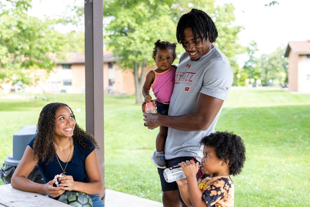 Wisconsin Badgers safety Travian Blaylock laughs with his family