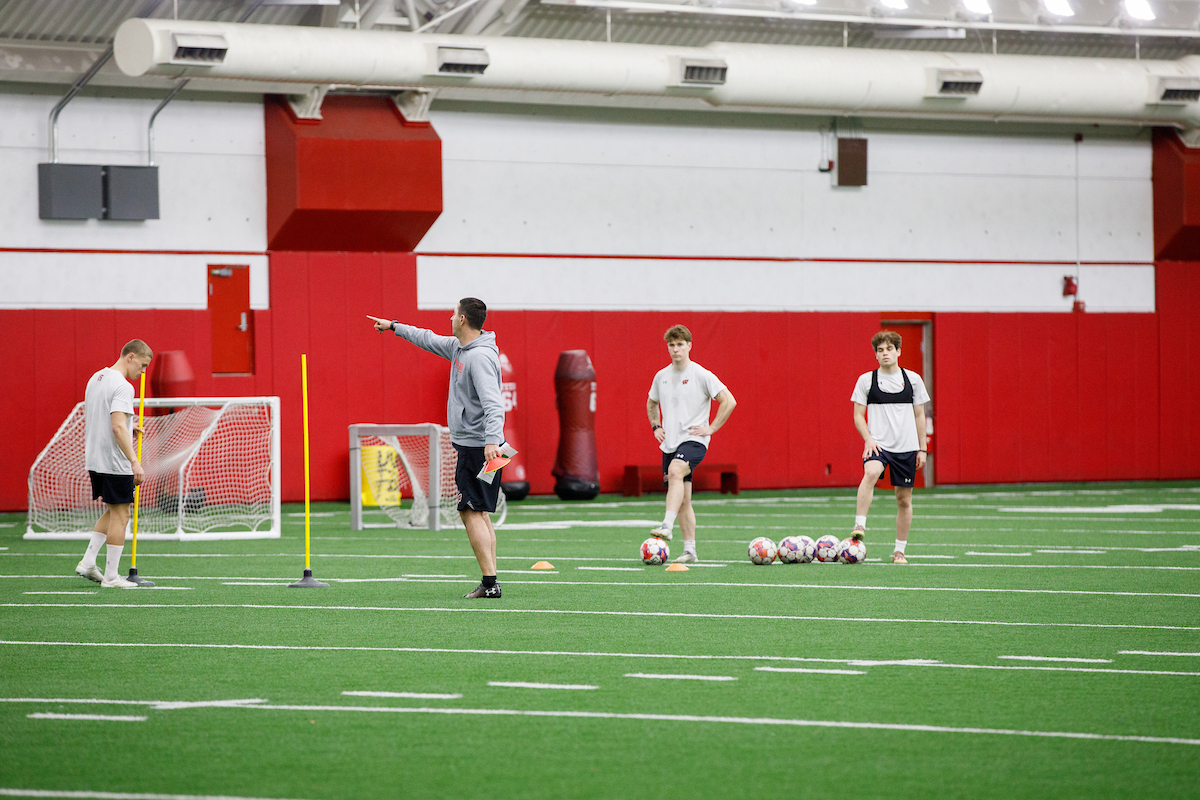 a coach instructing a soccer team