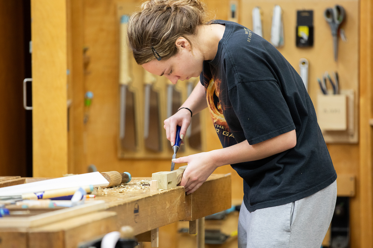 a student working on a woodworking project