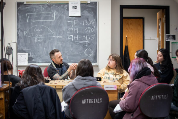 metals class teacher instructing students