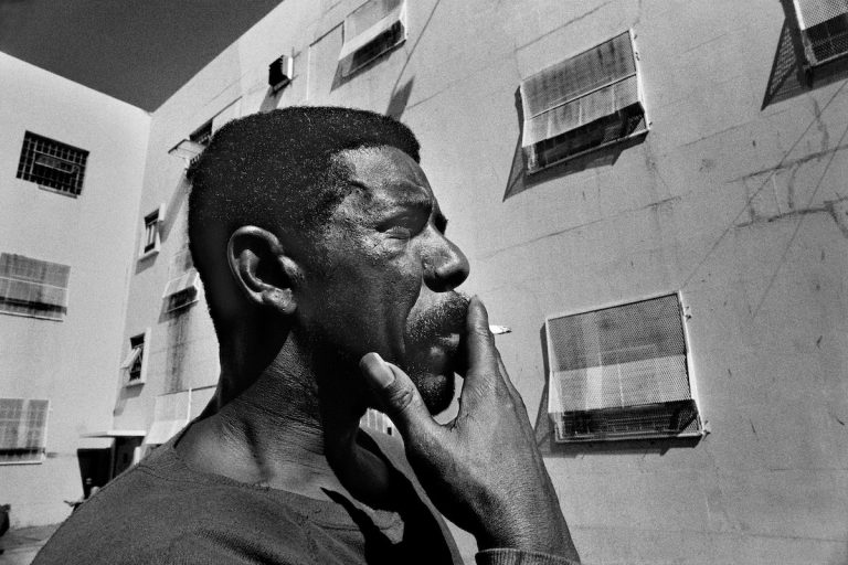 Francois smokes in the yard of a prison isolation ward at the California Medical Facility. From Darcy Padilla's project, "AIDS in Prison."