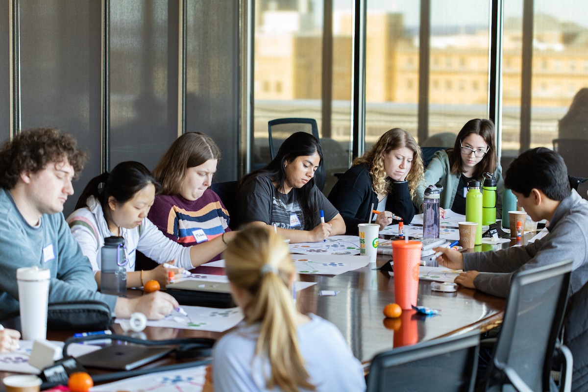 college students working at a large table