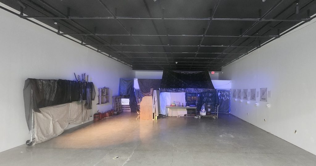 The Art Lofts Gallery transformed for Matthew Everett's "The Grindstone Campaign."