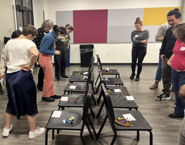Teacher participants in a recent study of arts-based professional learning do a gallery walk of sculptures they built.