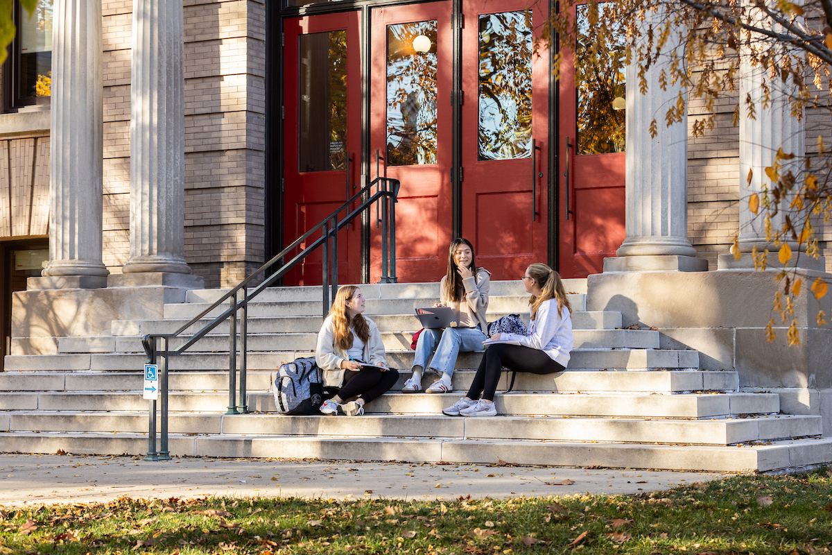 students sitting on steps