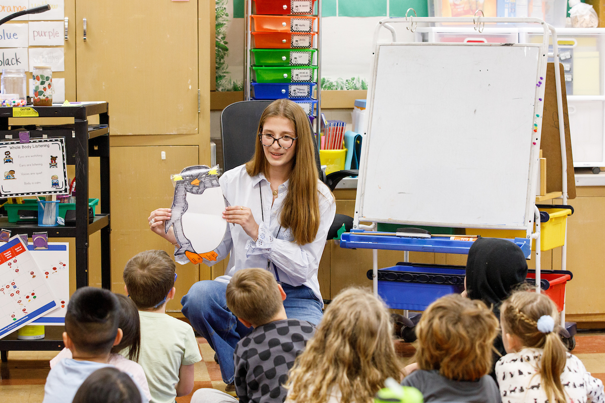 a teacher instructing small children