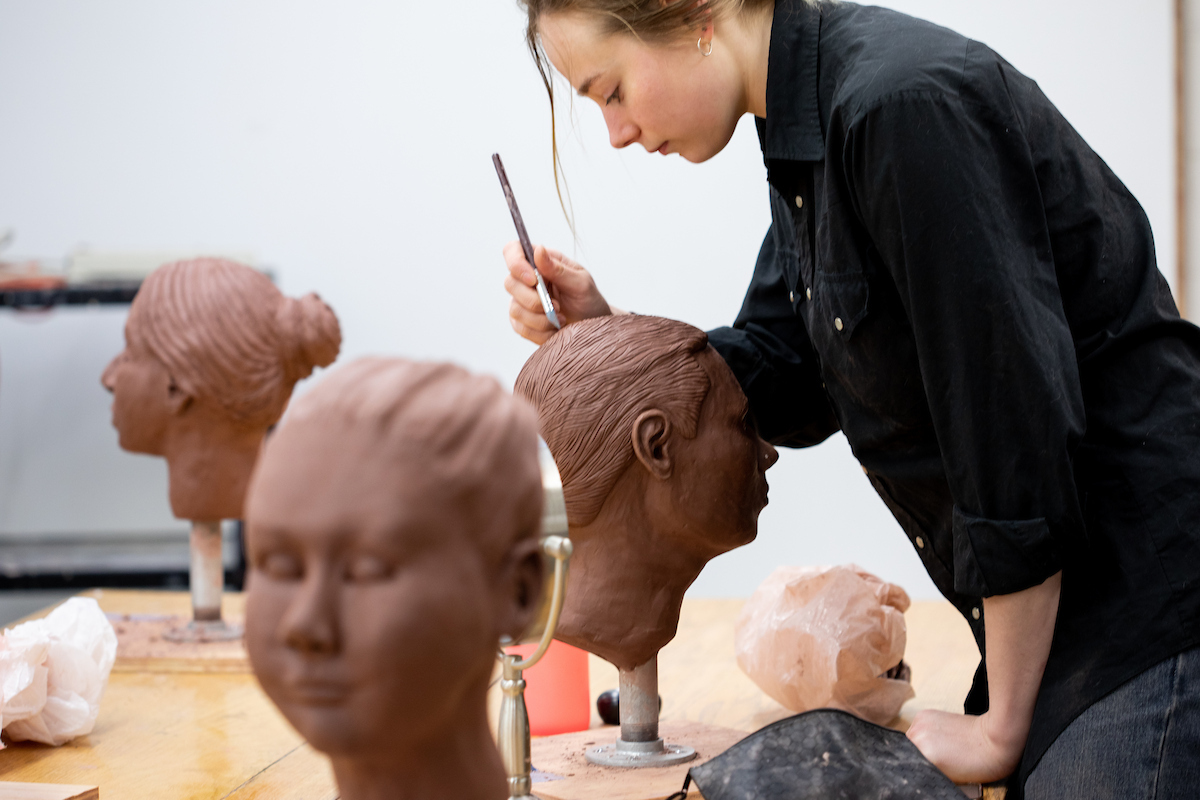 art student working on a sculpture
