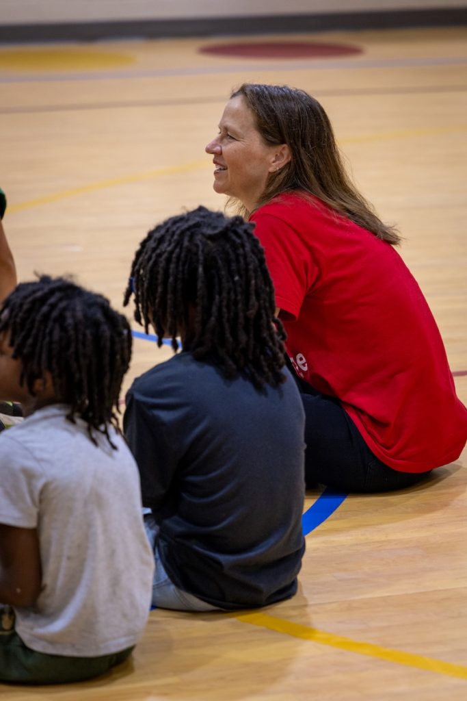 Chell Parkins (right) engages with students