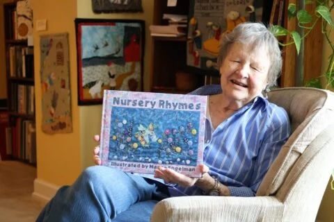 Engelman holding her book