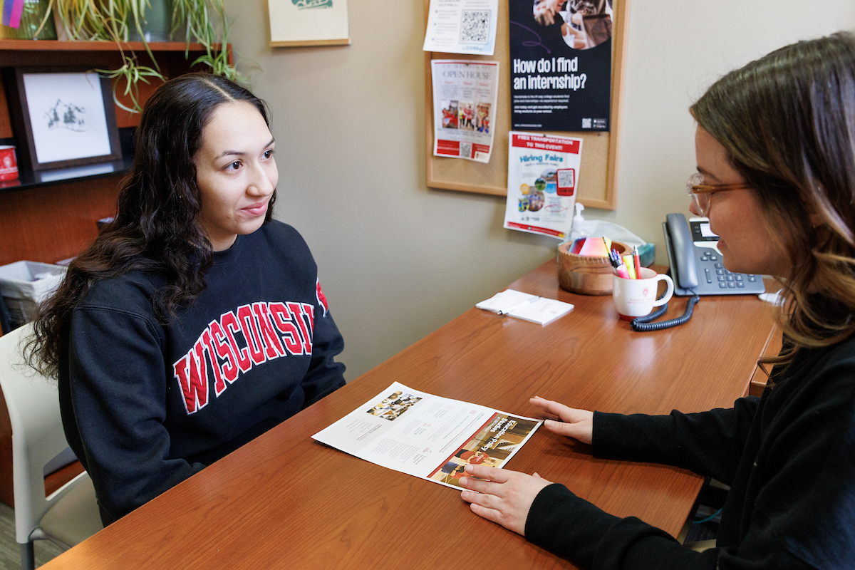 a student sits in a meeting with an advisor