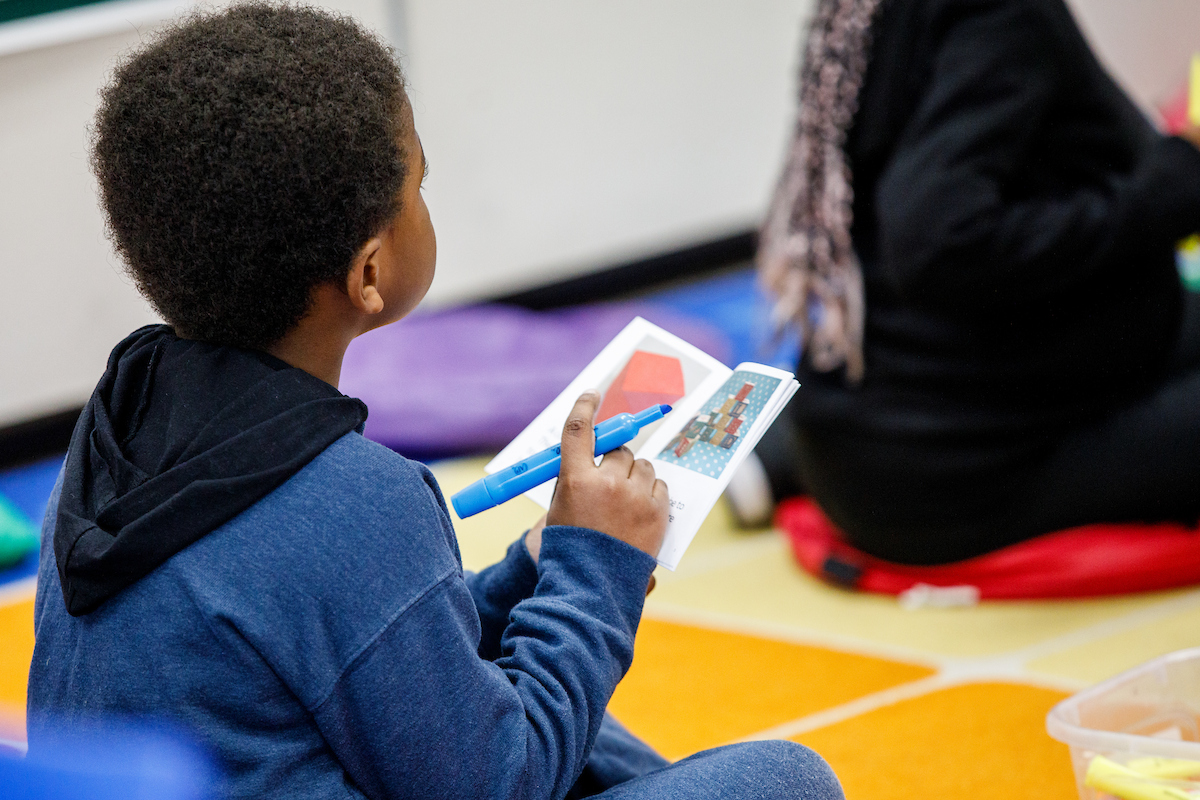 a child looking at a book