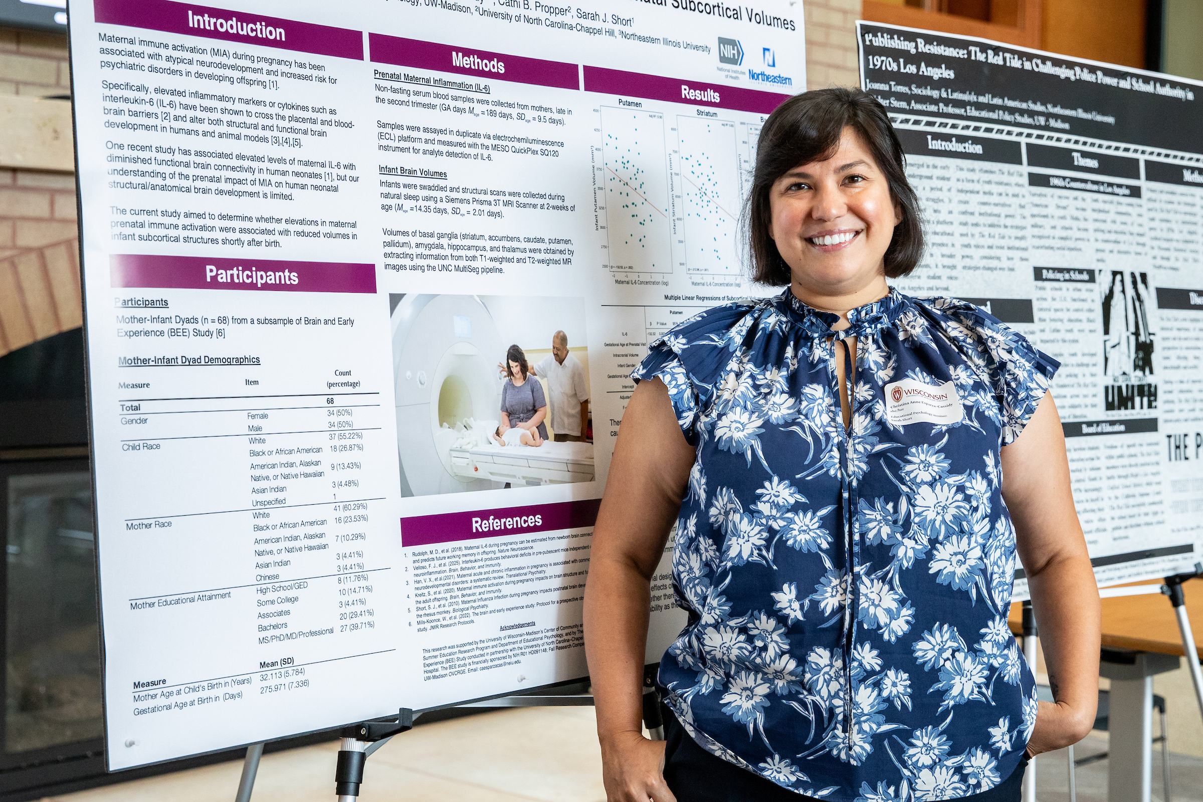 Christina Anne Esparza-Cassidy stands next to a SERP research poster.