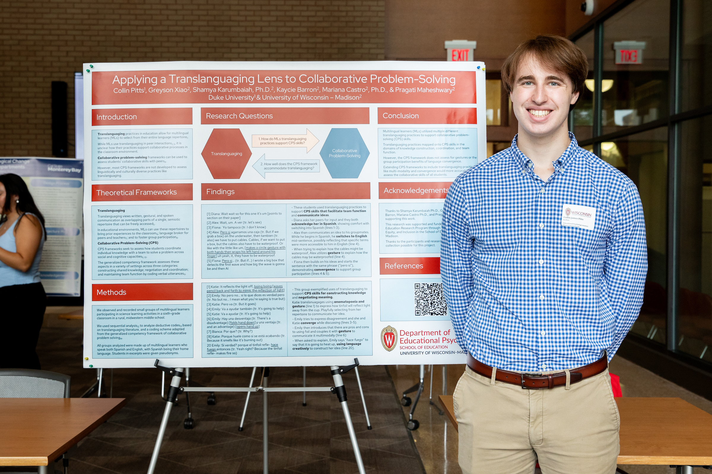 Collin Pitts stands next to a SERP research poster.