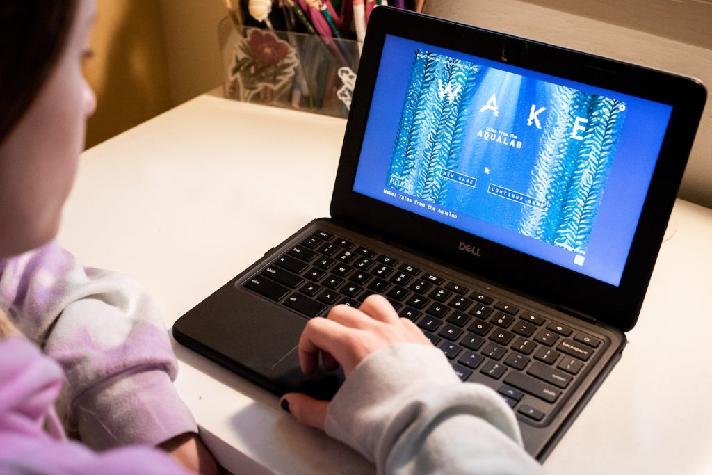 girl plays educational video game