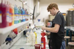 Dailey working in UW–Madison's screen printing studio.