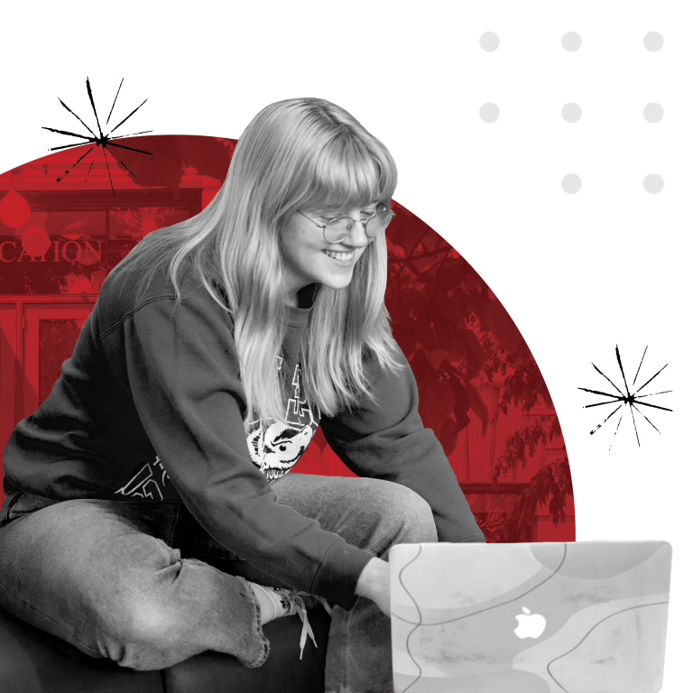 Student on computer, smiling