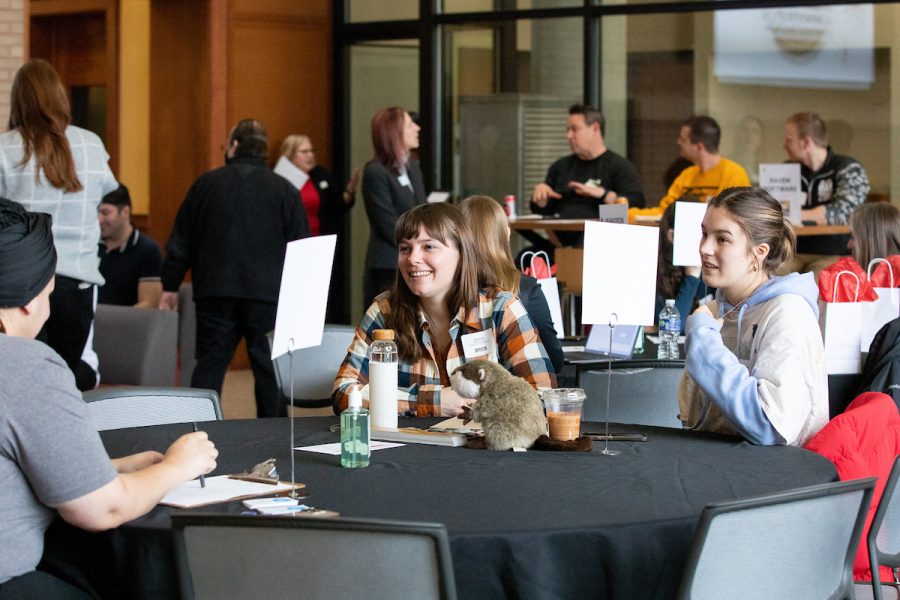Students meeting with companies at a career connector