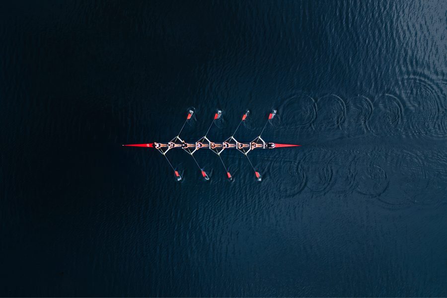 Aerial view of rowing team on lake