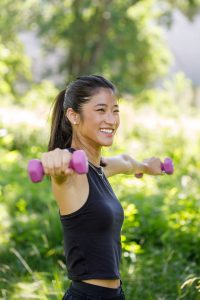 Woman holding weights doing resistance exercise's