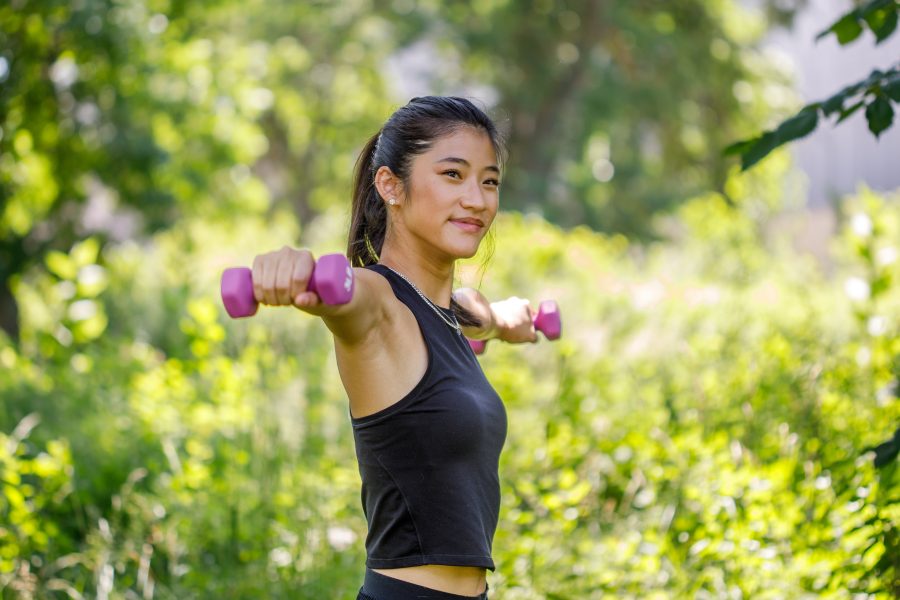 Woman holding weights doing resistance exercise's