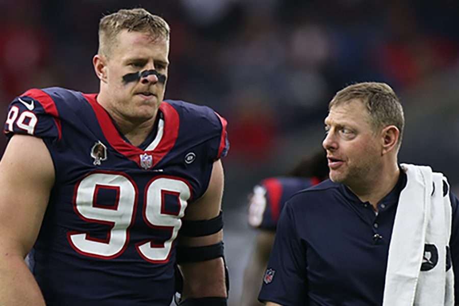 Geoff Kaplan walking alongside Houston Texans football player