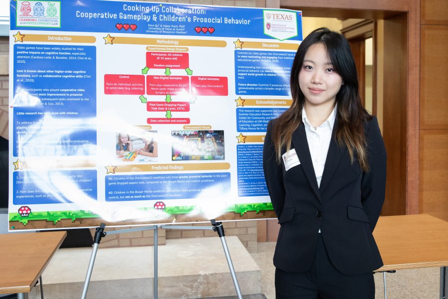 Alice Zhao Qu stands in front of a SERP research poster.
