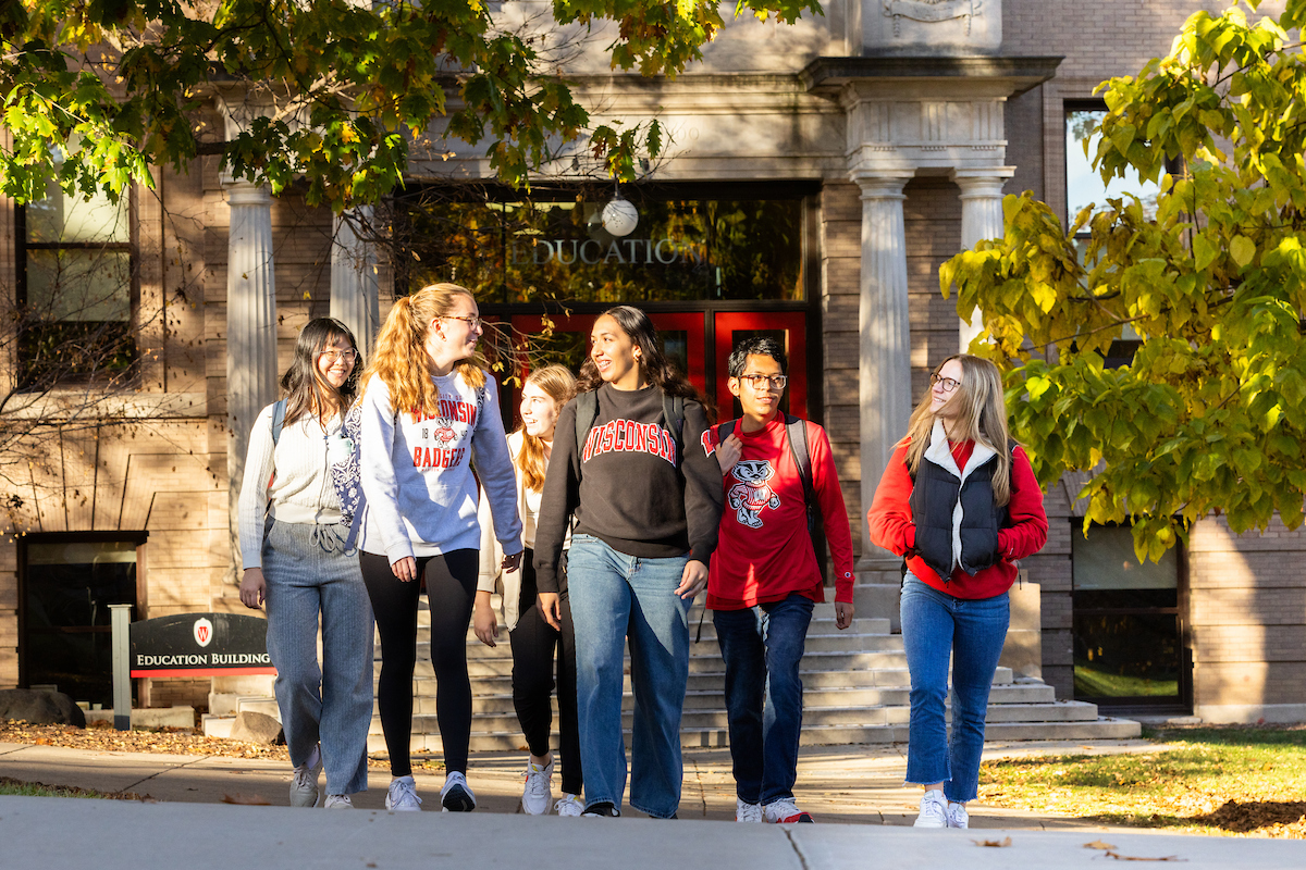 students walking out of the education building