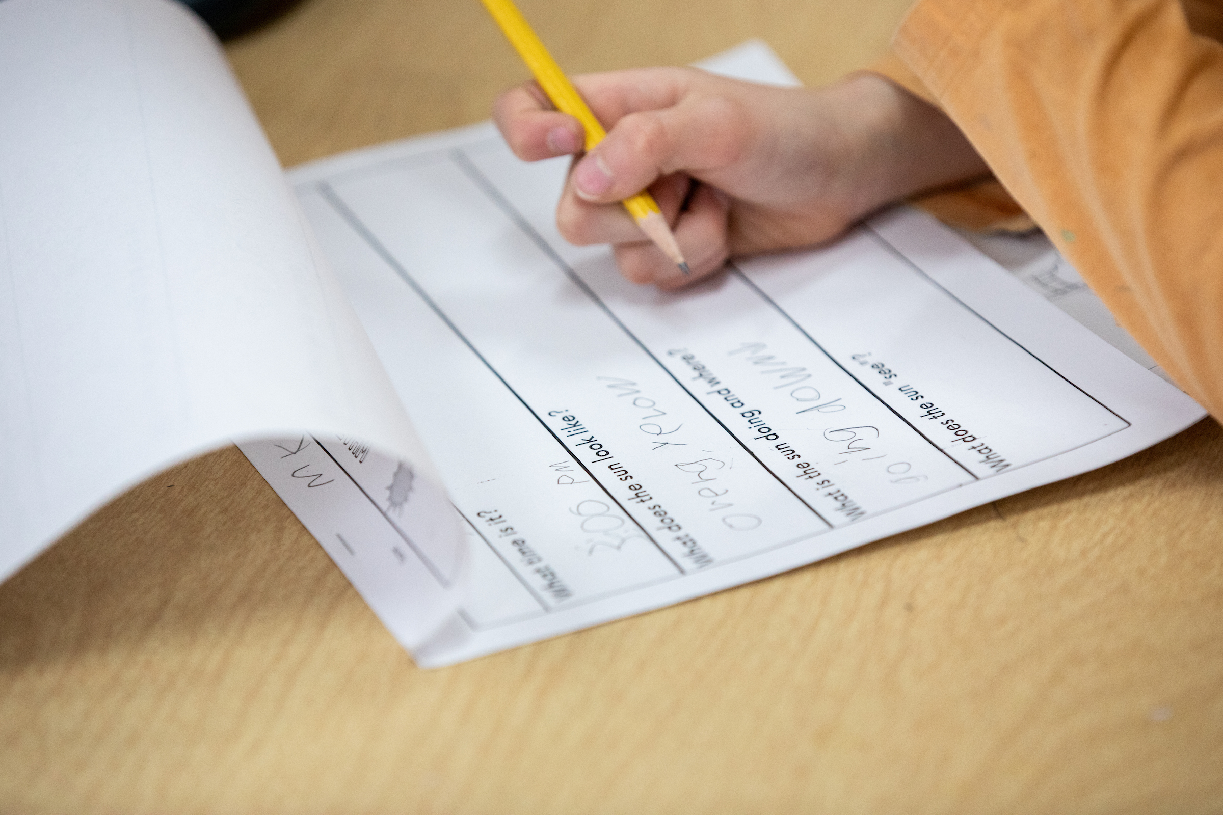 child taking a quiz at their desk